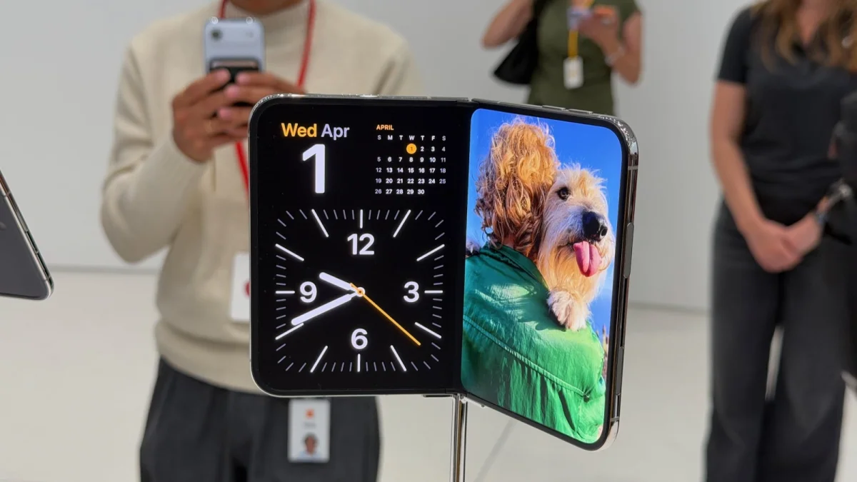 the iphone duo with clock and photos apps on screen